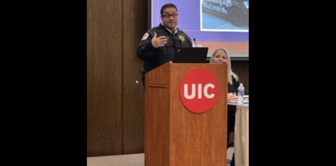 UICPD Captain Jason Huertas presenting at the podium